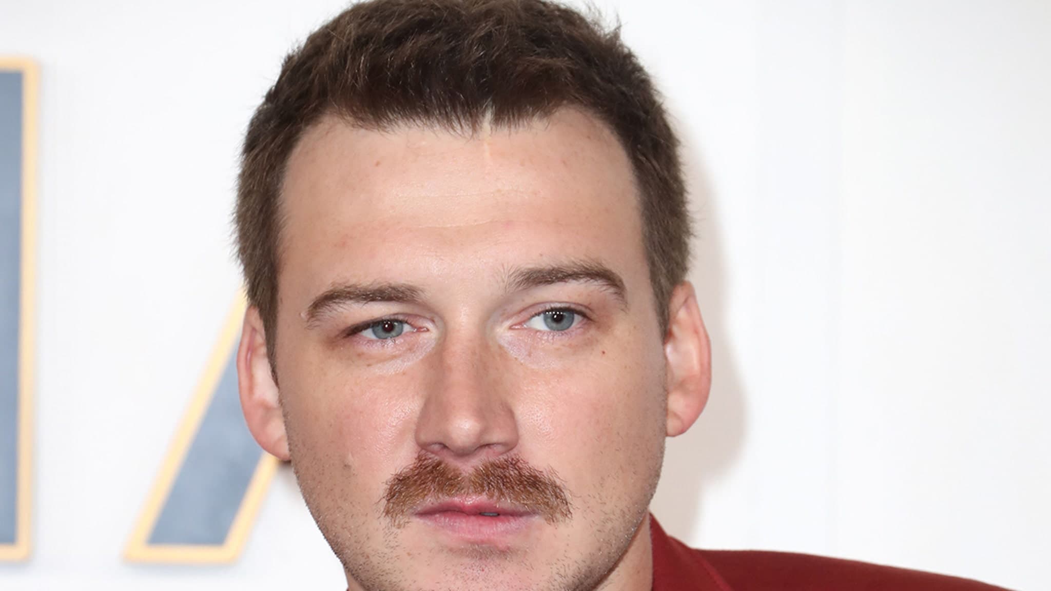The Shocking Arrest of the Infamous "Peeing Peon" at Morgan Wallen's Concert - Assault Charges Looming