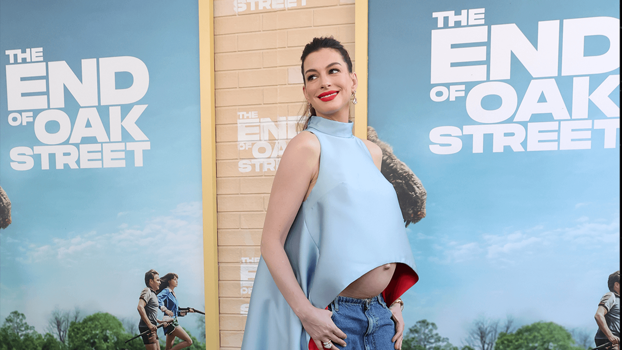Glowing in Blue: Anne Hathaway Dazzles at "The End of Oak Street" Premiere with Baby Bump on Display